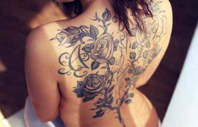 Tatueringar för flickor på ryggen: stilar, mönster, optioner