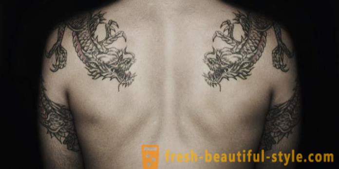 Män tatuering på ryggen: Fördelar, nackdelar och options skisser.